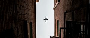 Preview wallpaper airplane, buildings, bottom view, flight