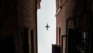 Preview wallpaper airplane, buildings, bottom view, flight