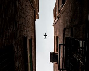 Preview wallpaper airplane, buildings, bottom view, flight