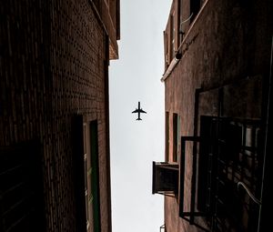 Preview wallpaper airplane, buildings, bottom view, flight