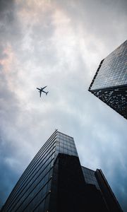 Preview wallpaper airplane, buildings, flight, bottom view, sky