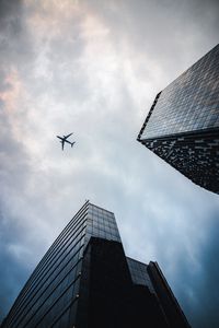 Preview wallpaper airplane, buildings, flight, bottom view, sky