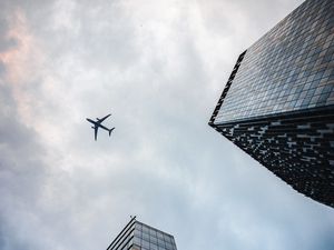 Preview wallpaper airplane, buildings, flight, bottom view, sky