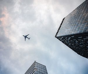 Preview wallpaper airplane, buildings, flight, bottom view, sky