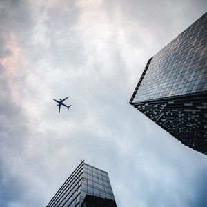 Preview wallpaper airplane, buildings, flight, bottom view, sky