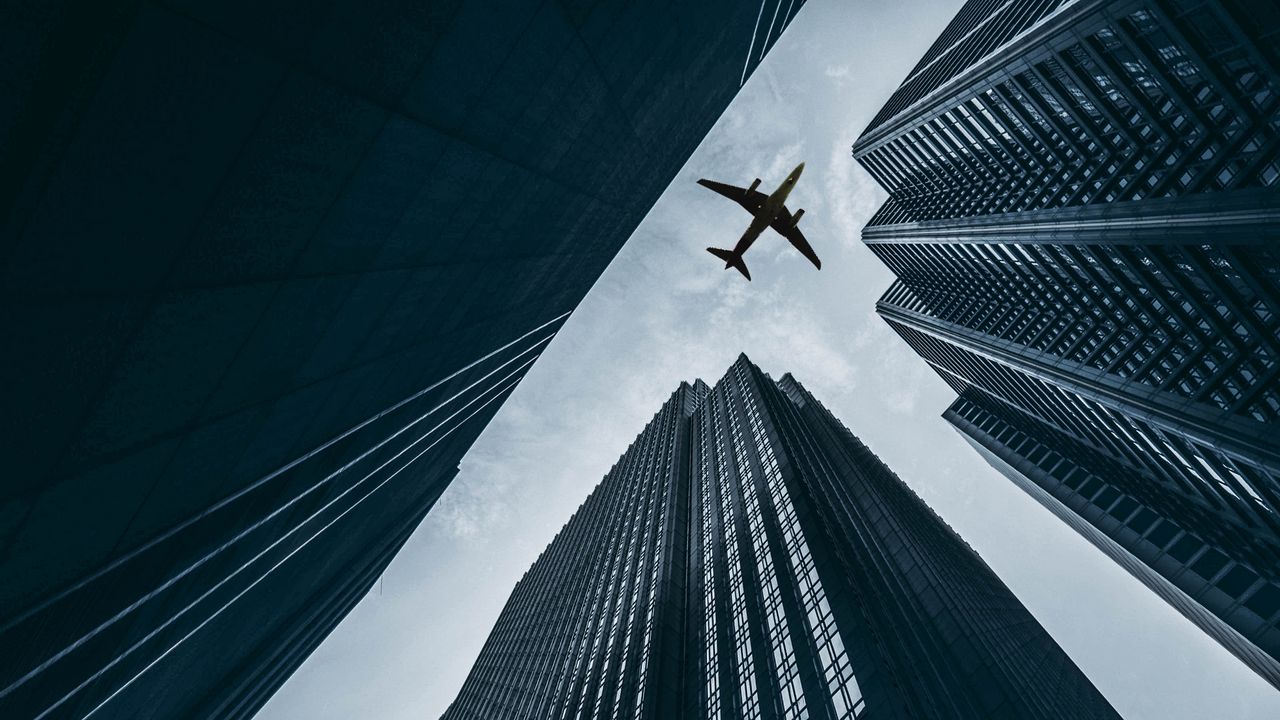 Wallpaper airplane, buildings, skyscrapers, sky