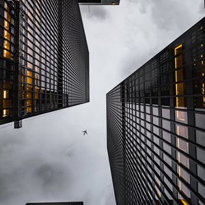 Preview wallpaper airplane, buildings, skyscrapers, bottom view