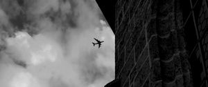 Preview wallpaper airplane, clouds, flight, building, black and white