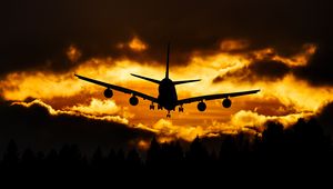 Preview wallpaper airplane, clouds, sky, sunset