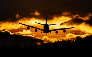 Preview wallpaper airplane, clouds, sky, sunset