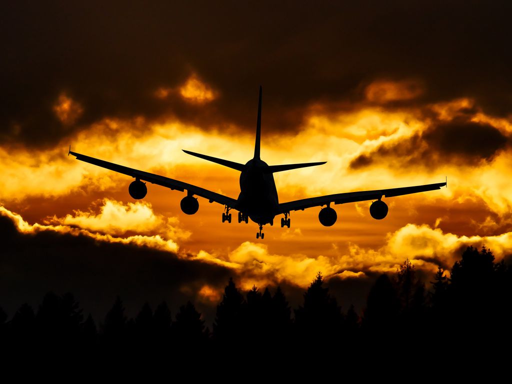 1024x768 Wallpaper airplane, clouds, sky, sunset