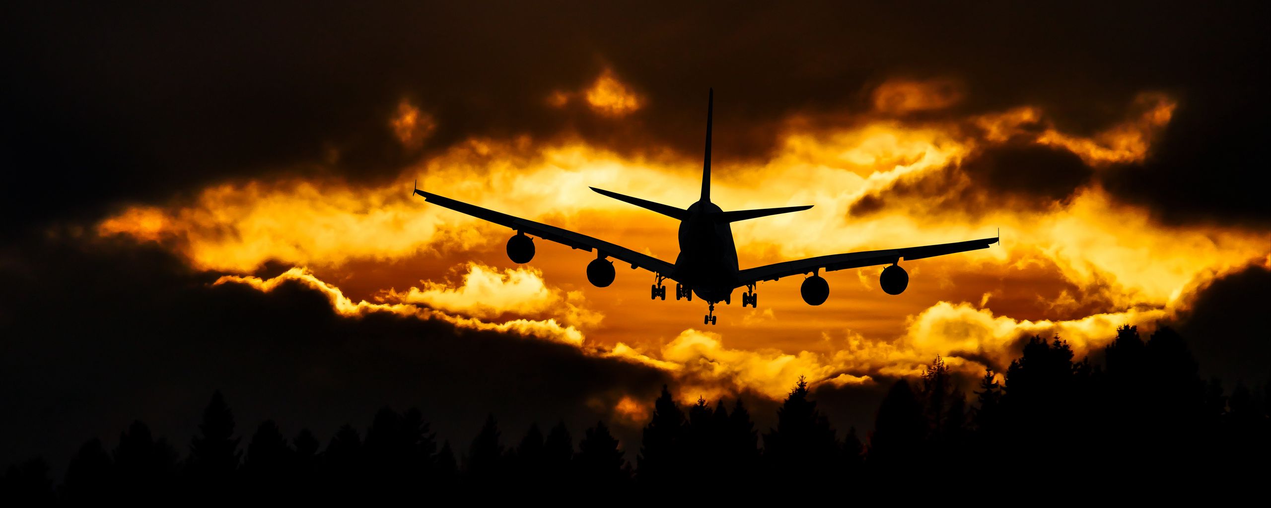 Download wallpaper 2560x1024 airplane, clouds, sky, sunset ultrawide