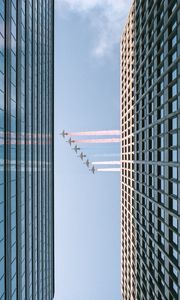 Preview wallpaper airplane, colored smoke, building