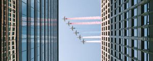 Preview wallpaper airplane, colored smoke, building