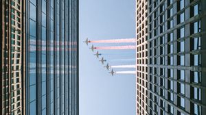 Preview wallpaper airplane, colored smoke, building