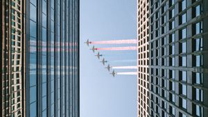 Preview wallpaper airplane, colored smoke, building