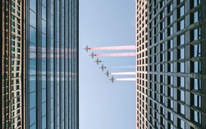 Preview wallpaper airplane, colored smoke, building