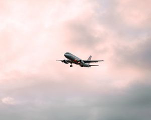 Preview wallpaper airplane, flight, sky, clouds, pink