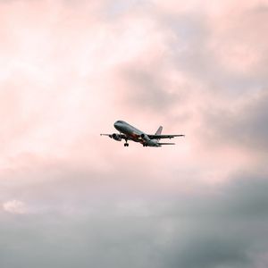 Preview wallpaper airplane, flight, sky, clouds, pink