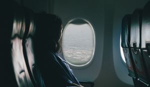 Preview wallpaper airplane, girl, flight, travel, porthole