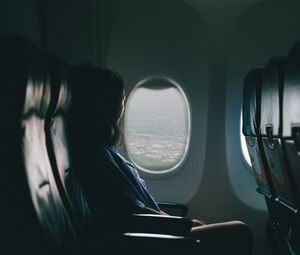 Preview wallpaper airplane, girl, flight, travel, porthole