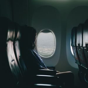 Preview wallpaper airplane, girl, flight, travel, porthole