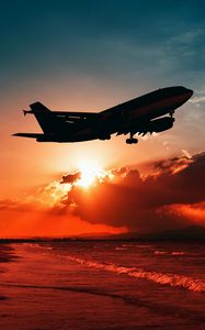 Preview wallpaper airplane, sea, sunset, takeoff, silhouette, sky