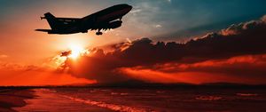 Preview wallpaper airplane, sea, sunset, takeoff, silhouette, sky