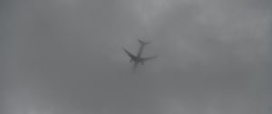 Preview wallpaper airplane, sky, clouds, dark, black and white