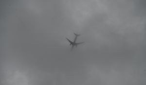Preview wallpaper airplane, sky, clouds, dark, black and white