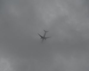 Preview wallpaper airplane, sky, clouds, dark, black and white