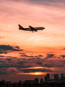 Preview wallpaper airplane, sky, flight, clouds, sunset