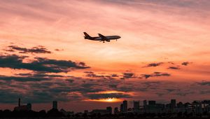 Preview wallpaper airplane, sky, flight, clouds, sunset