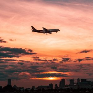 Preview wallpaper airplane, sky, flight, clouds, sunset