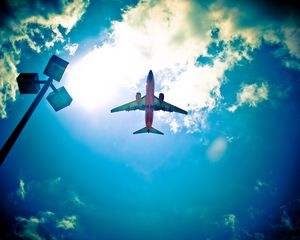 Preview wallpaper airplane, sky, flight, clouds, light