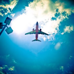 Preview wallpaper airplane, sky, flight, clouds, light