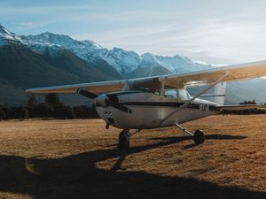 Preview wallpaper airplane, transport, metal, mountains, snowy