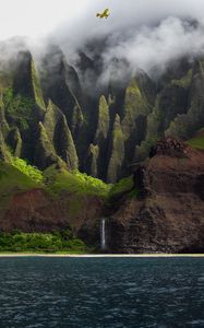 Preview wallpaper airplane, waterfall, rocks, fog, sea, relief