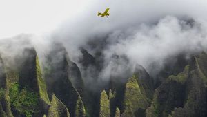 Preview wallpaper airplane, waterfall, rocks, fog, sea, relief