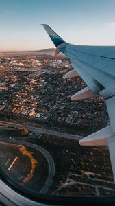 Preview wallpaper airplane, wing, city, aerial view, overview