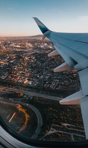 Preview wallpaper airplane, wing, city, aerial view, overview