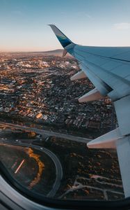 Preview wallpaper airplane, wing, city, aerial view, overview