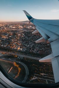 Preview wallpaper airplane, wing, city, aerial view, overview