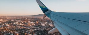 Preview wallpaper airplane, wing, city, aerial view, overview