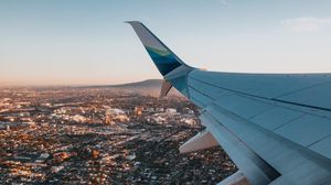 Preview wallpaper airplane, wing, city, aerial view, overview