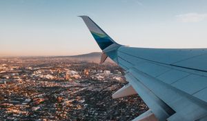 Preview wallpaper airplane, wing, city, aerial view, overview