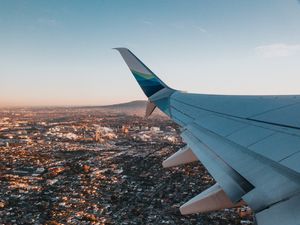 Preview wallpaper airplane, wing, city, aerial view, overview