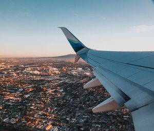 Preview wallpaper airplane, wing, city, aerial view, overview