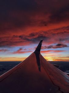 Preview wallpaper airplane, wing, clouds, sky, sunset