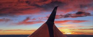 Preview wallpaper airplane, wing, clouds, sky, sunset